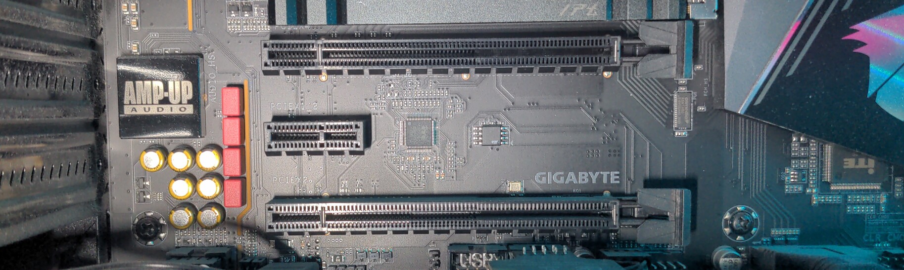 Three PCIe slots on a desktop PC motherboard.
